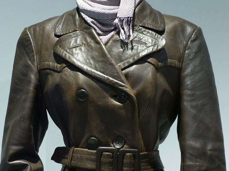 Leather jacket displayed on a mannequin, showcasing its rich texture and classic design, emphasizing the importance of specialty cleaning and restoration for leather items.